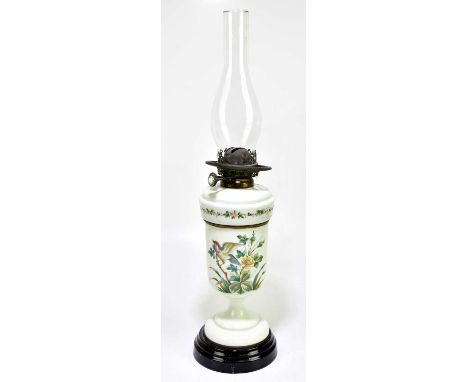 A Victorian opaque glass oil lamp with painted decoration, height to top of chimney 63cm.