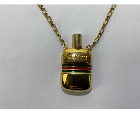 GUCCI; a vintage glass perfume bottle pendant with maker's marks to front and 'Italy' to back, with green and red stripe, sto