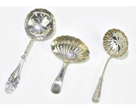 A George III hallmarked silver caddy spoon with pierced shell moulded bowl with engraved initial to the terminal, London 1806