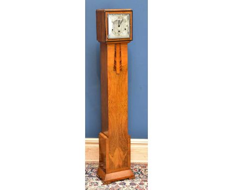 An Art Deco walnut longcase clock of small proportions, the silvered dial set with Arabic numerals, with applied decoration, 