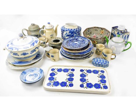 A quantity of blue and white ceramics to include plates, tureens, with further teapots and mugs.