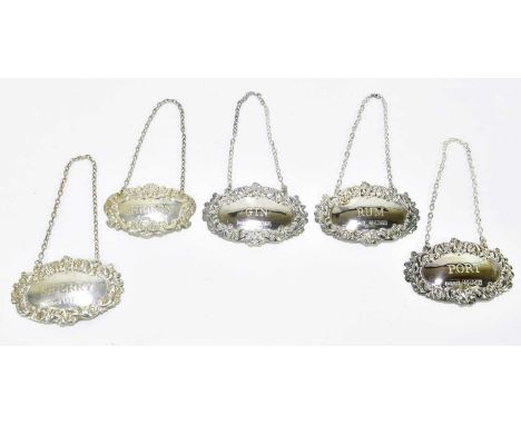 DAVID HOLLANDER &amp; SONS; four Elizabeth II hallmarked silver decanter labels, sherry, gin, port and rum, Birmingham 1972-7