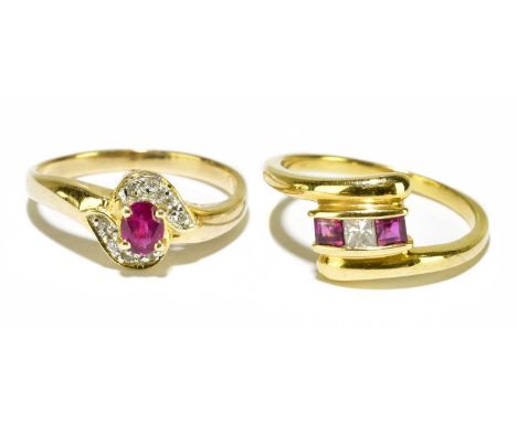 An 18ct yellow gold diamond and ruby dress ring, size I 1/2, approx. 3g, and a 14ct yellow gold ruby and diamond cluster dres