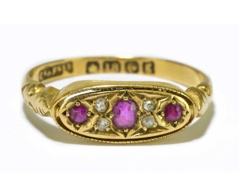 An Edwardian 18ct yellow gold diamond and ruby seven stone dress ring, approximate size O, approximate weight 2.6g.