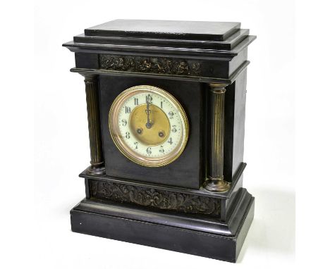 A Victorian slate mantel clock with applied metal panels and Corinthian columns, the dial bearing Arabic numerals and inscrib