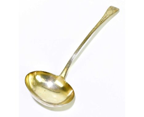 REID &amp; SONS; a Victorian hallmarked silver soup ladle with bright cut decoration surrounding an oval vacant cartouche, Ne