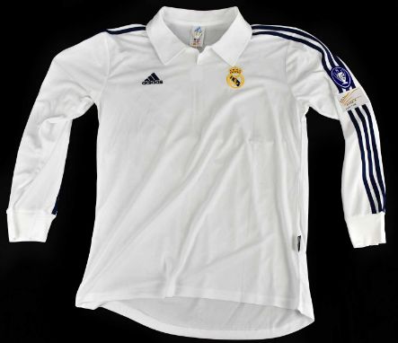 ZINEDINE ZIDANE; a signed Real Madrid centenary shirt, signed to the reverse, size L.Condition Report: Creasing and light gen