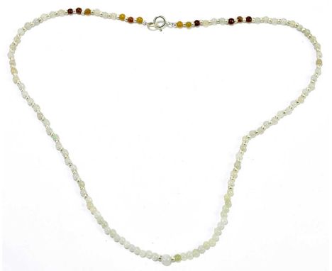 A jade bead necklace with white metal spacers and clasp, length 42cm. 
