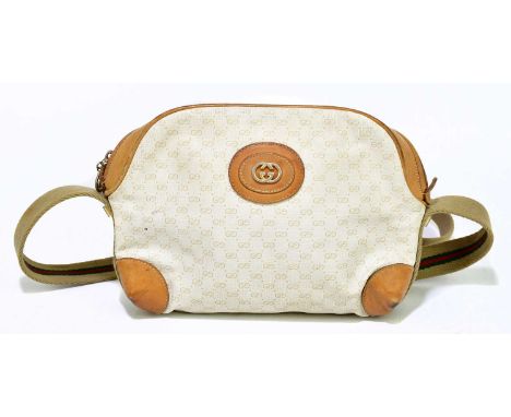 GUCCI; a 1980s vintage monogram coated canvas shoulder bag with tan leather trim to top corners and front logo, with a cloth 