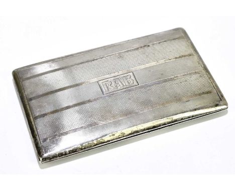 A white metal rectangular cigarette case with engine turned decoration and gilded interior, with rectangular cartouche and en