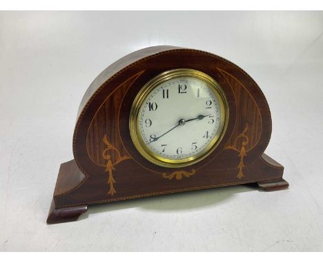 A mahogany inlaid mantel clock, with white enamel face set with Arabic numerals, height 16cm.