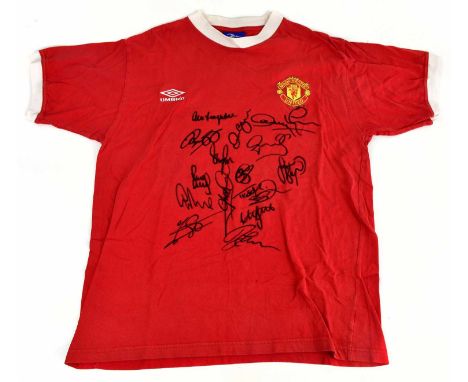 MANCHESTER UNITED; a 1999 Umbro multi-signed shirt, signed to the front by Ferguson, Beckham, Yorke, Giggs, Schmeichel, Irwin