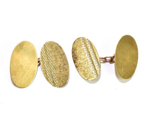 A pair of 9ct yellow gold oval cufflinks with chain links and engine turned decoration, approx. 4.7g. 