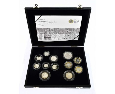 A cased 2009 silver proof coin set with twelve encapsulated coins, no.3498 with certificate of authenticity.