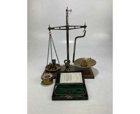 A late 19th century set of brass balance scale with assorted weights, together with a barometer and cased blood corpuscles co