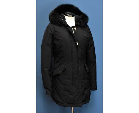 WOOLRICH; a black short length padded jacket, with long sleeves, zip and tortoiseshell button front, front pockets and a deta