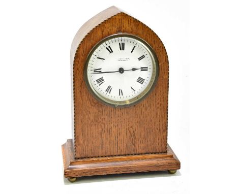 LAMBERT WOLF, MANCHESTER; a late 19th century inlaid oak lancet mantel clock, the enamel dial set with Roman numerals, on fou