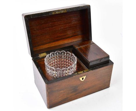 A mahogany tea caddy, enclosing a glass mixing jar and tea box, 14 x 22 x 14cm.