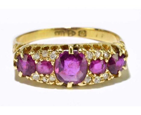 An 18ct yellow gold ruby and diamond ring set with five rubies and twelve diamond chips, size M 1/2, approx. 3.3g. 