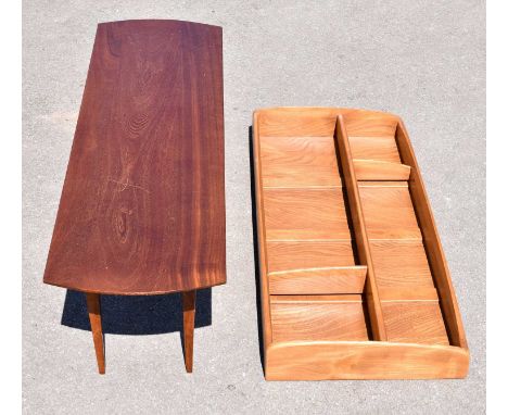 A 1970s rectangular coffee table on tapering block legs, width 123cm, with an Ercol medium elm hanging shelf with panelled ba