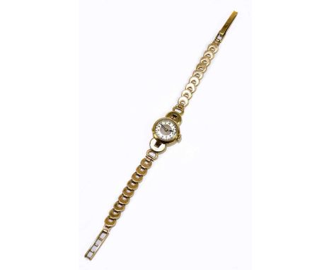 A lady's vintage 9ct yellow gold wristwatch with Arabic numerals to the dial, approx. 12.1g, sold with an associated Omega wa