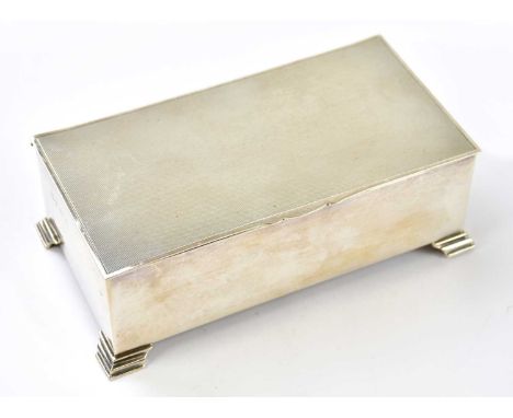 BARKER ELLIS SILVER CO LTD; an Elizabeth II hallmarked silver engine turned decorated rectangular cigarette box inscribed to 