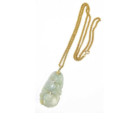 A Chinese russet included jade pendant suspended on a 18ct yellow gold fancy link trace chain, chain length 60cm and approx 1