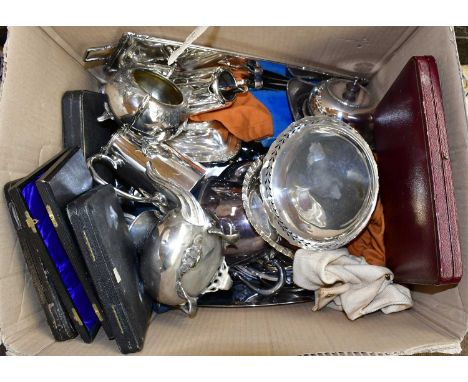 A large collection of assorted silver plate to include cased flatware, a twin handled tray, pedestal bowls, entree dishes, et