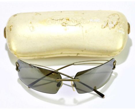 CHANEL; a pair of vintage sunglasses with gold tone CC logo to side arms with crystals and logo to end of arms, in original c