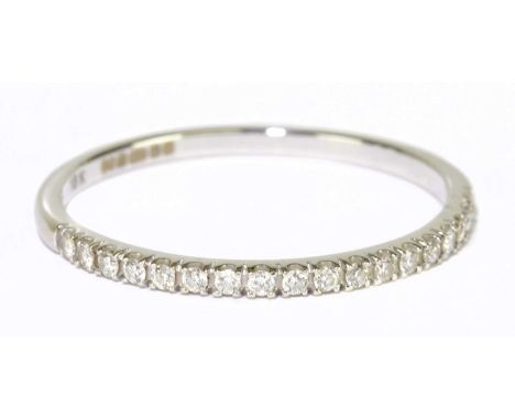 An 18ct white gold and diamond set half eternity ring with brilliant cut stones, size R, approx 1.6g.