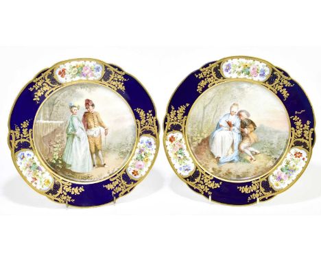 SEVRES; two hand painted cabinet plates, each painted to the centre with classical figures in landscape scenes inside a borde