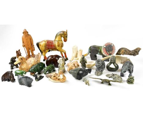 A small quantity of Inuit carvings, together with various other hardstone carvings.Condition Report: Lion is ceramic and indi