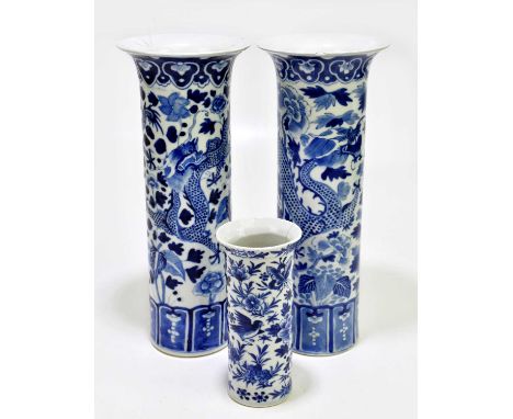 A near pair 19th century Chinese blue and white porcelain sleeve vases, decorated with four claw dragons, each bearing four c