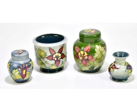 MOORCROFT; four pieces, decorated in the 'Arum Lily' pattern, to include two ginger jars and covers, height of largest exampl