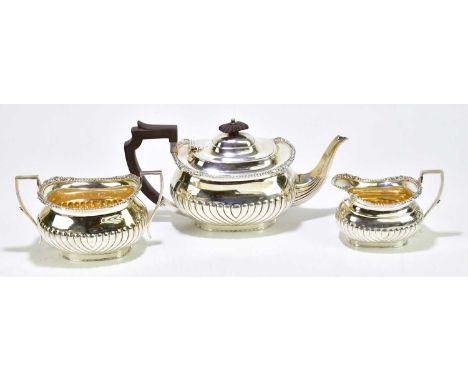 AITKEN BROS; a George VI hallmarked silver three piece tea service, with gadrooned decoration, Sheffield 1947, approx weight 