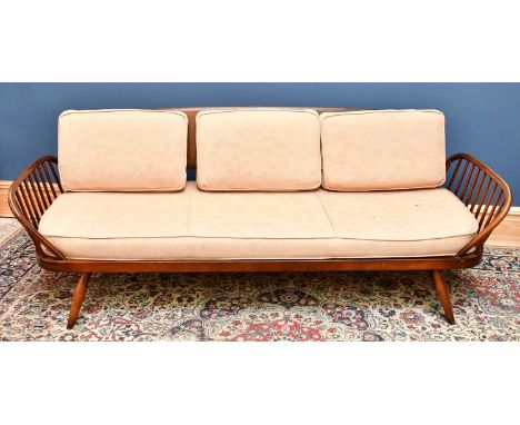 ERCOL; a dark elm day bed.