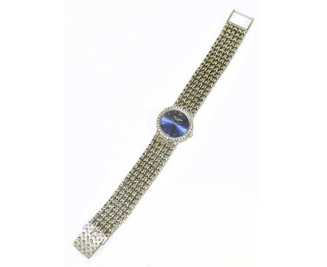 PATEK PHILIPPE; a lady's 18ct white gold wristwatch with blue dial, diamond set bezel and Milanese mesh bracelet, length 17cm