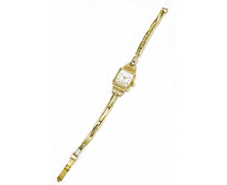 MUDU; a lady's vintage 18ct yellow gold wristwatch with seventeen jewel movement on 9ct sprung loaded expandable bracelet, co