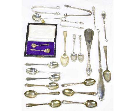 A quantity of silver and white metal, including sugar tongs, teaspoons, button hook, shoe stretcher, etc, various hallmarks. 