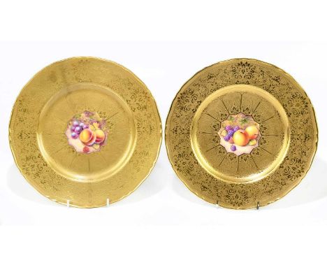  REED FOR ROYAL WORCESTER; a pair of hand painted and gilt decorated cabinet plates of circular form, relief decorated with f