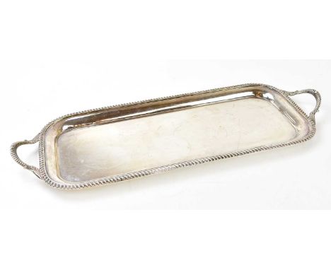 BARKER ELLIS SILVER CO LTD; an Elizabeth II hallmarked silver twin handled rounded rectangular tray with bead decorated borde