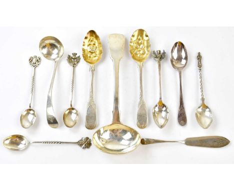 A group of silver flatware, comprising Fiddle pattern sauce ladle, a small ladle engraved with a crest, pair of 'Berry' teasp