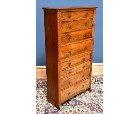 A narrow chest of eight drawers, height 120cm, width 65cm, depth 24cm.Condition Report: Cup rings, impressions and marks to t
