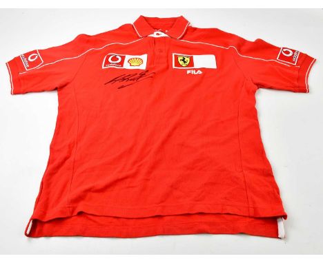 MICHAEL SCHUMACHER; a signed FILA Ferrari polo shirt, signed to the front, size L.Condition Report: Creasing and light genera