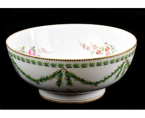 A 19th century hand painted footed bowl decorated with floral sprays, bears gilt initial B3 to the underside, diameter 29.5cm