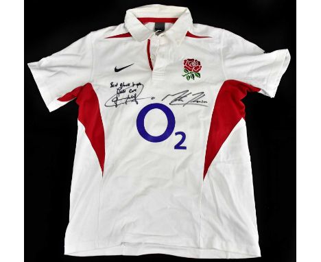 ENGLAND RUGBY; a signed 2003 rugby shirt, signed by Johson and Wilkinson, size M.Condition Report: Creasing and light general
