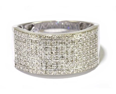 A large 18ct white gold pave diamond set ring, the diamonds totalling approx. 1ct, size X 1/2, approx. 7.5g.Condition Report: