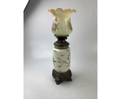 A decorative oil lamp decorated with butterflies and flowers, height 55cm.Condition Report: Possible replacement shade, wear 