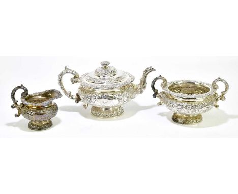 ALEXANDER EDMONSTOUN III; a George IV hallmarked silver three piece tea service with repoussé floral decoration and engraved 