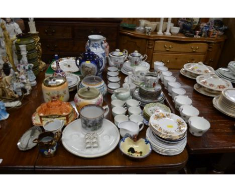 A Poole; pottery vase; a Royal Albert "Old Country Roses" wall clock; a cottageware butter dish; two rose decorated biscuit b